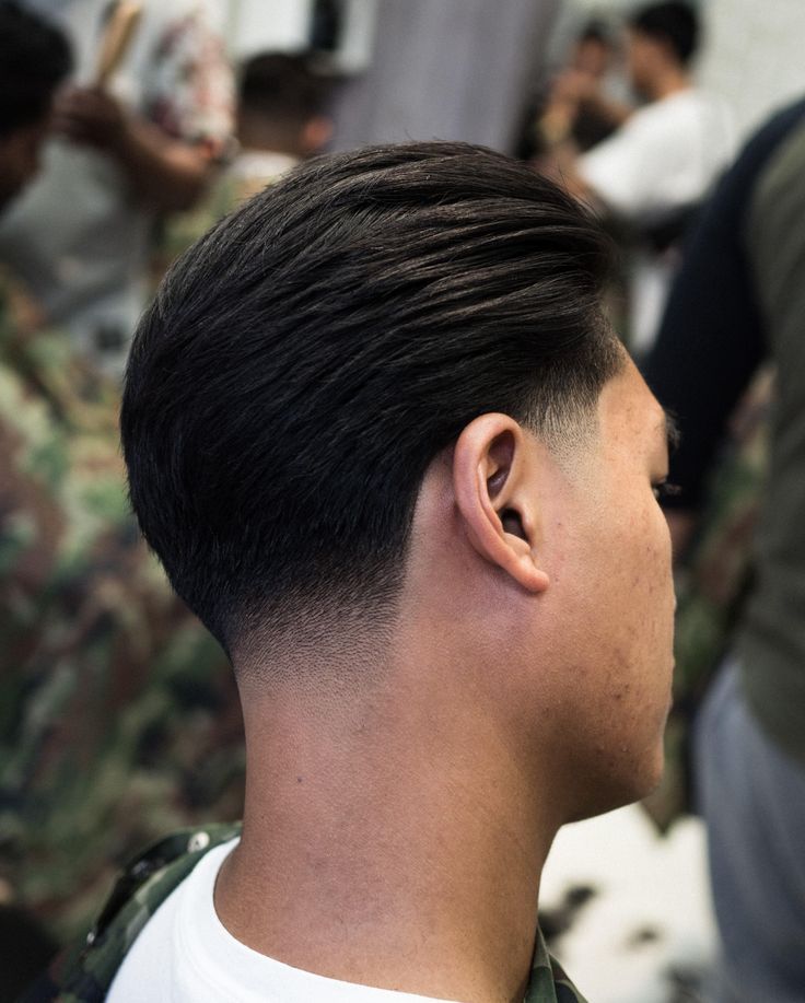 Classic slick back with low fade at Empire Barbershop Amsterdam