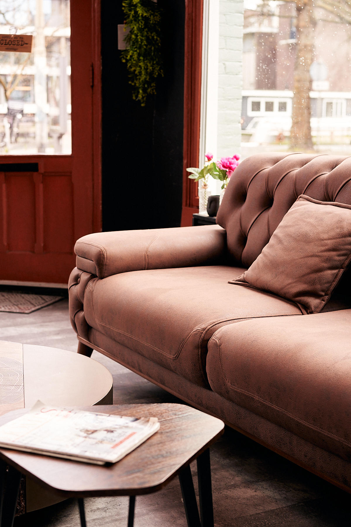 Chesterfield sofa and coffee table in Empire Barbershop lounge